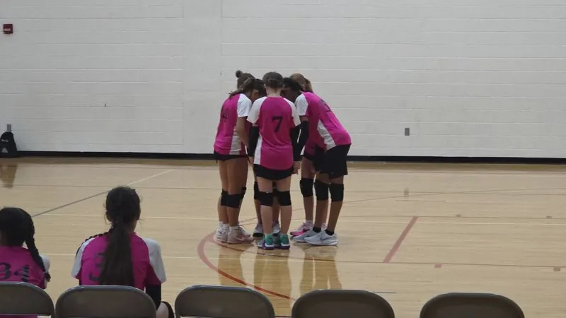 Pink Panthers in a huddle